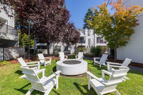 Poolside fire pit with adirondack chairs.