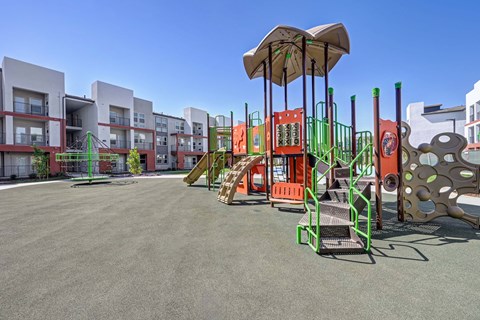 Community playground with exterior in the background.