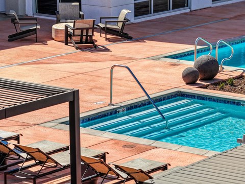 Pool entry with railing and stairs.