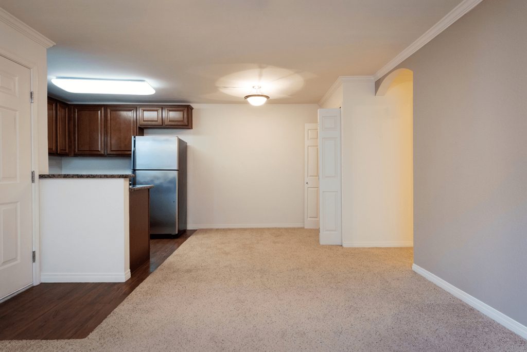 a kitchen and dining area in a 555 waverly unit