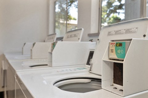 a row of washing machines in a laundromat