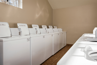 a washer and dryer are available in the laundry room