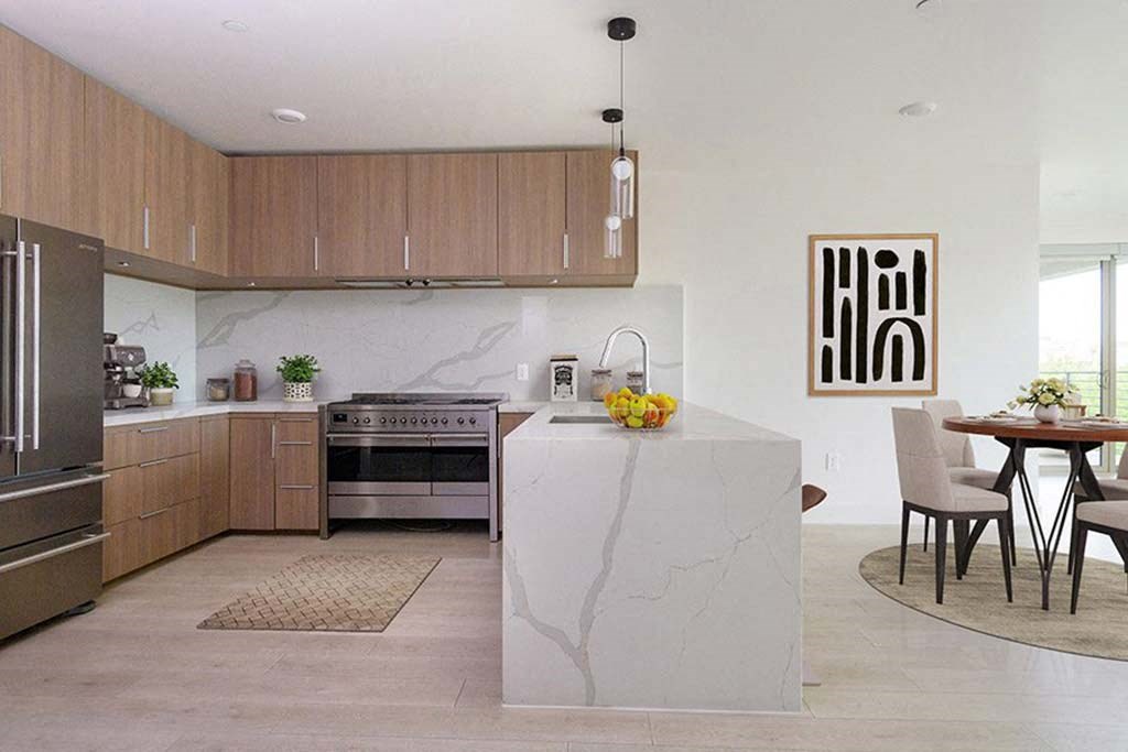 a kitchen and dining room with a table and chairs