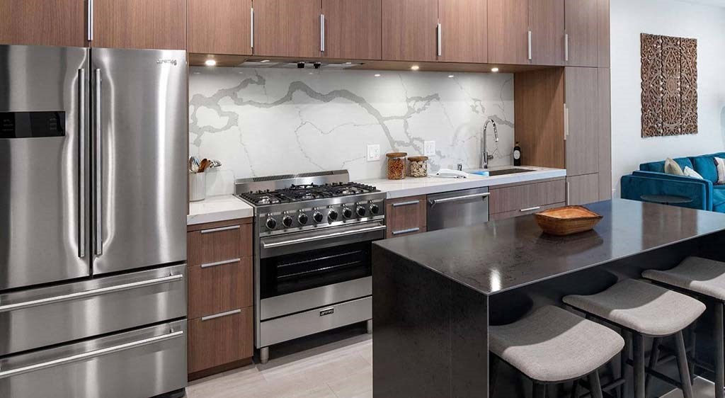 a kitchen with a stove top oven next to a counter