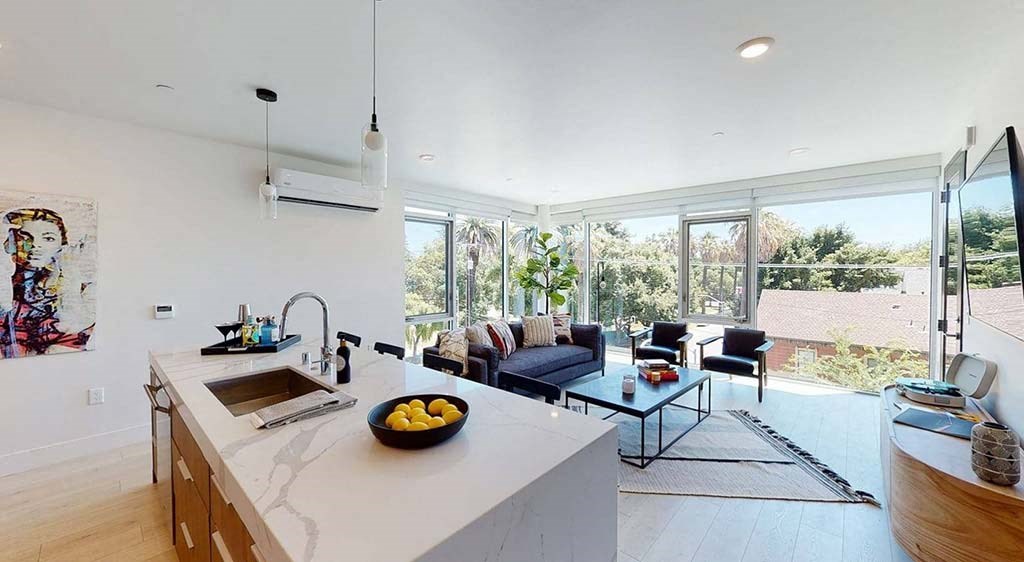a kitchen and living room with a large window