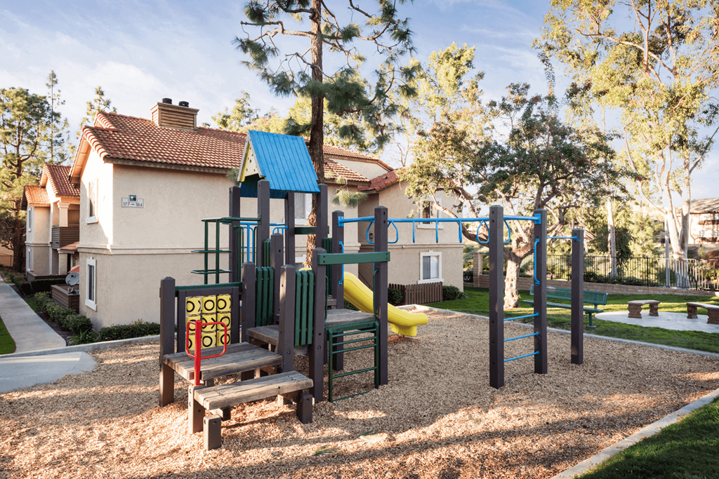 a playground at the whispering winds apartments in pearland, tx