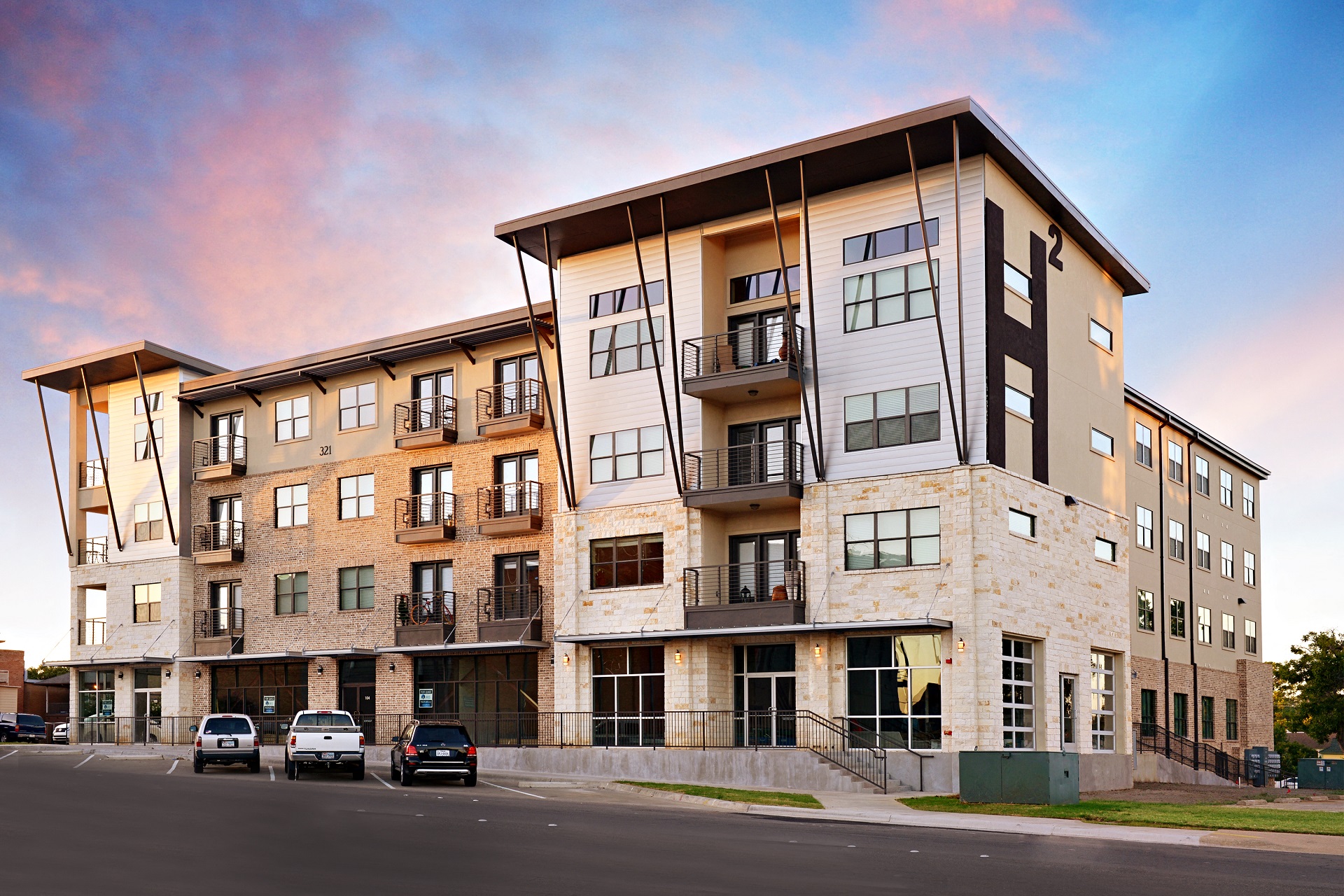 Apartments with a balcony and a covered entrance at H Squared Apartments, Denton, TX, 76201