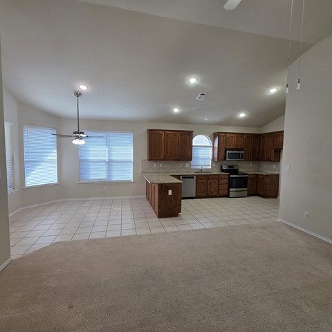 A kitchen with white cabinets and a countertop.