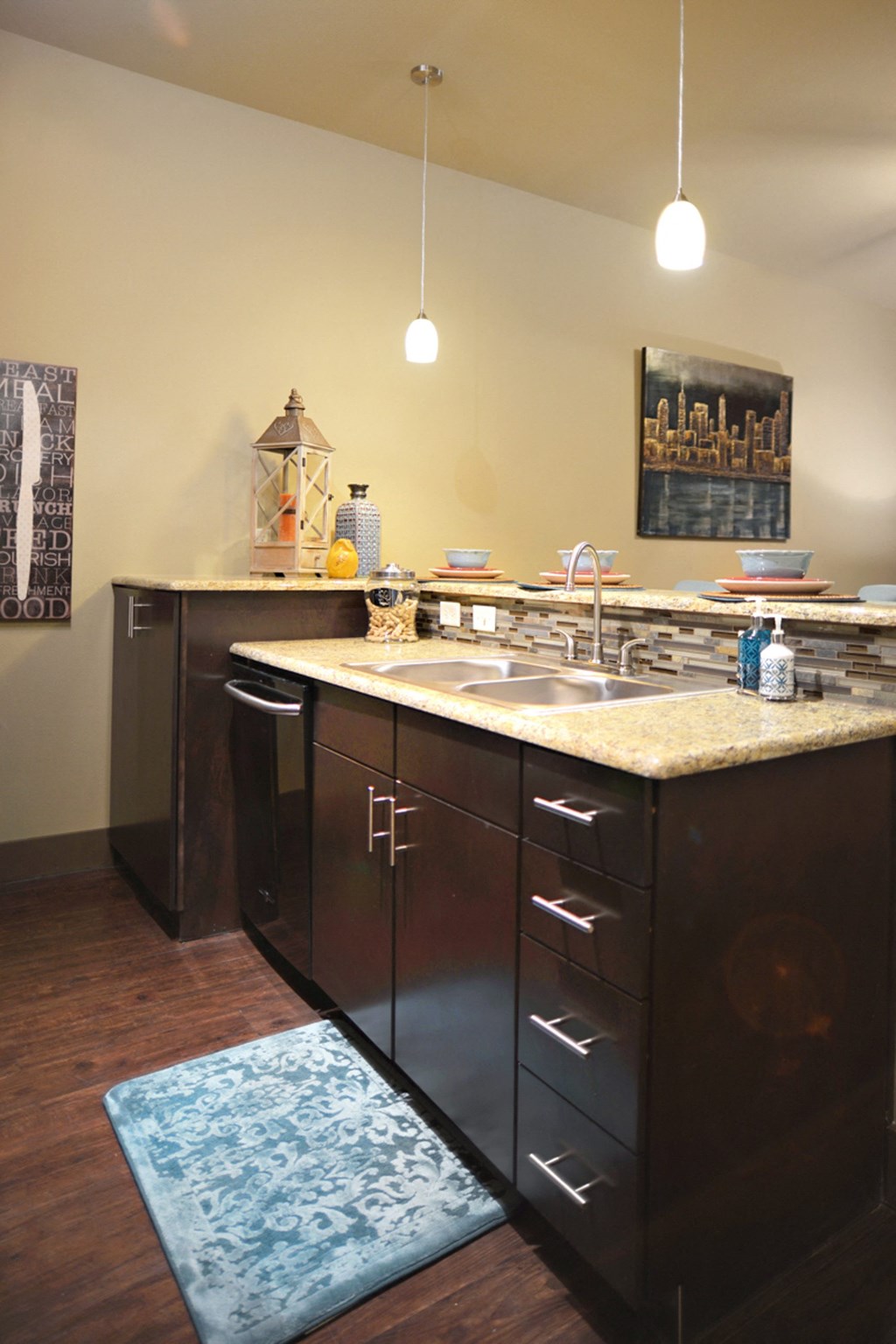 a kitchen with a sink and cabinets and a counter top