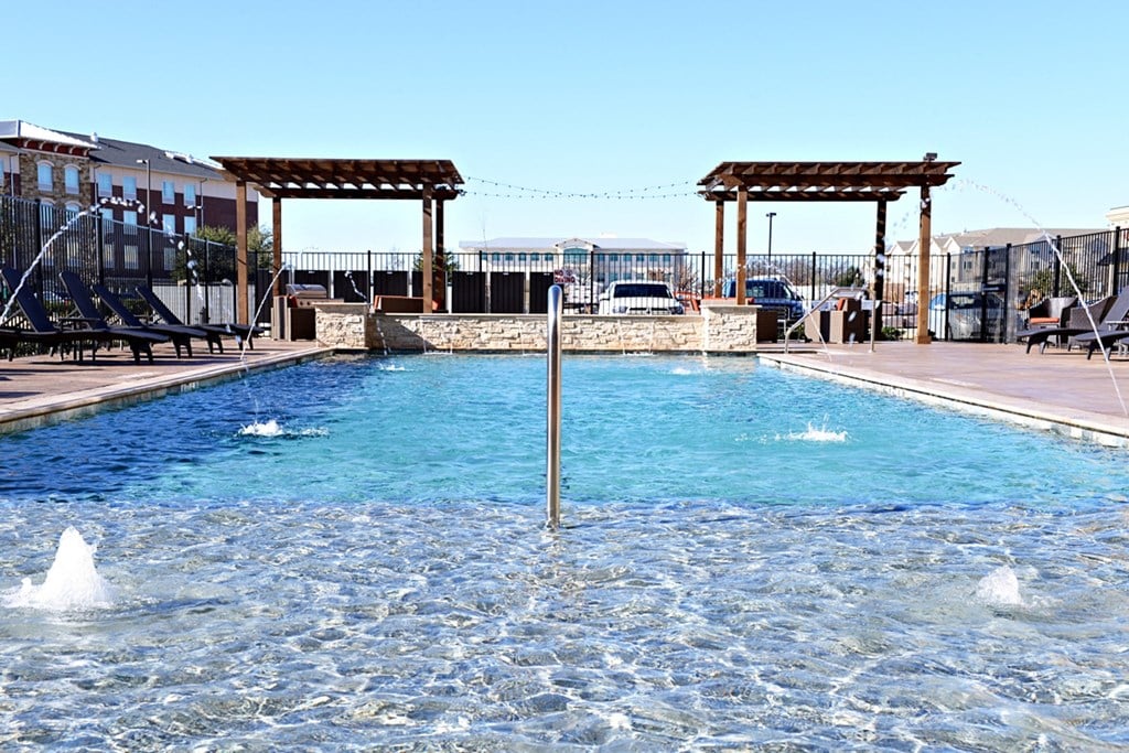 the pool is heated and has views of the mountains and the sky at Urban Square, Denton, 76210