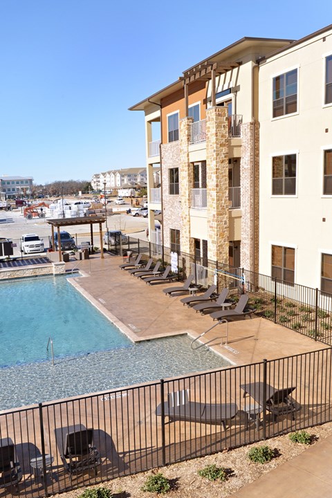 a swimming pool at a hotel with a view of the city