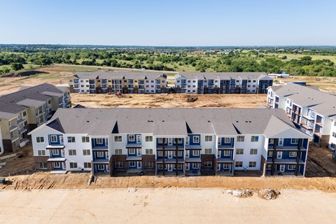 A large building complex with multiple buildings in different colors.