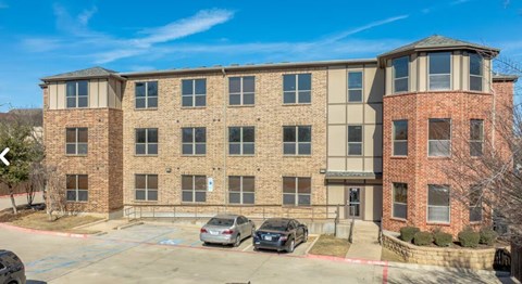 Exterior view of three story apartment building at City Place Apartments, Denton
