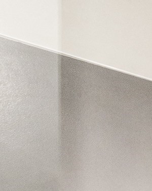 a bathroom with a shower and a toilet in it