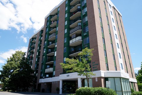 an apartment building on the corner of a street