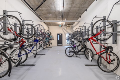 a group of bikes parked in a white room