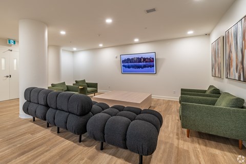 a living room with couches and chairs and a table