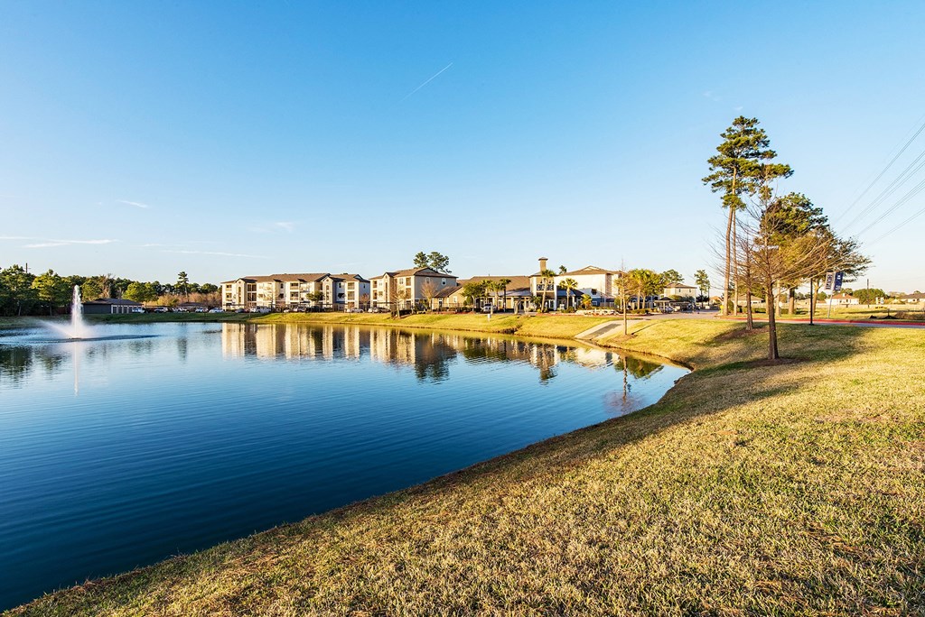 a view of a lake with houses in the background