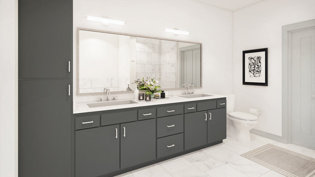a bathroom with black cabinets and a white tile floor