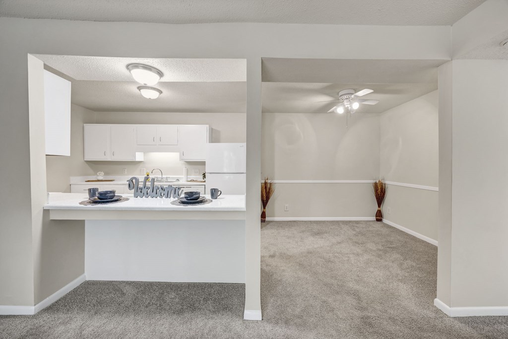 A kitchen with a dining table and chairs at Peachtree Place Apartments, Columbia, SC, 29210