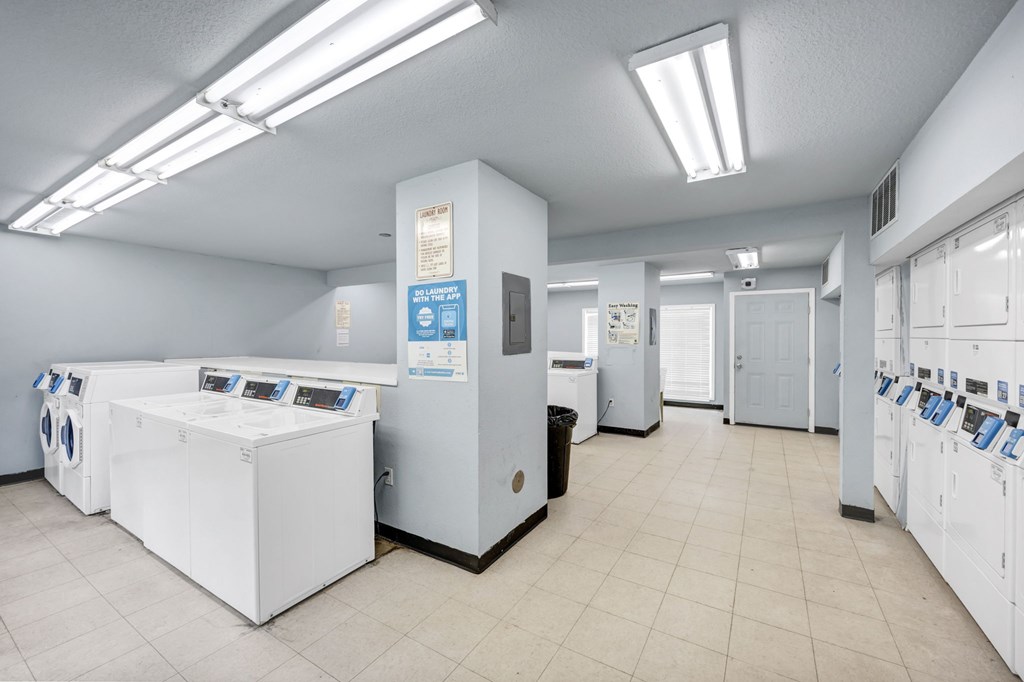 A laundromat with washers and dryers at Peachtree Place Apartments, Columbia, South Carolina