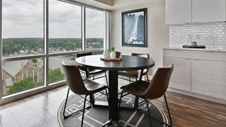 Cozy dining room with large windows and view of the city at CityView on Meridian, Indianapolis, IN,46208