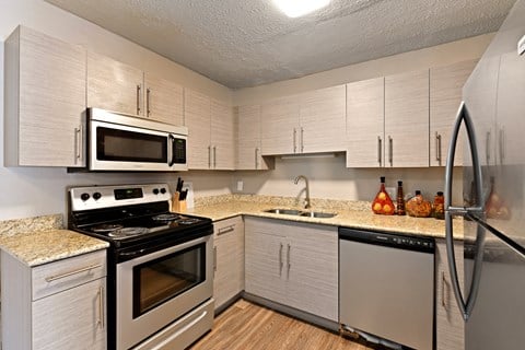 A newly renovated kitchen with stainless steel appliances at Heritage Hill Estates Apartments, Cincinnati, Ohio 45227