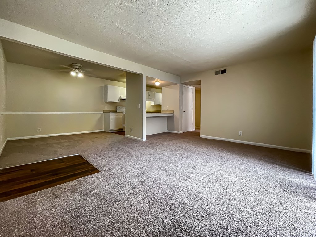 A spacious room with a carpeted floor and a ceiling fan. A spacious room with a carpeted floor and a ceiling fan.at Peachtree Place, Columbia, SC