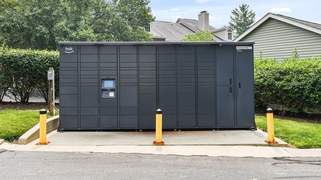 a small black building on the side of a street