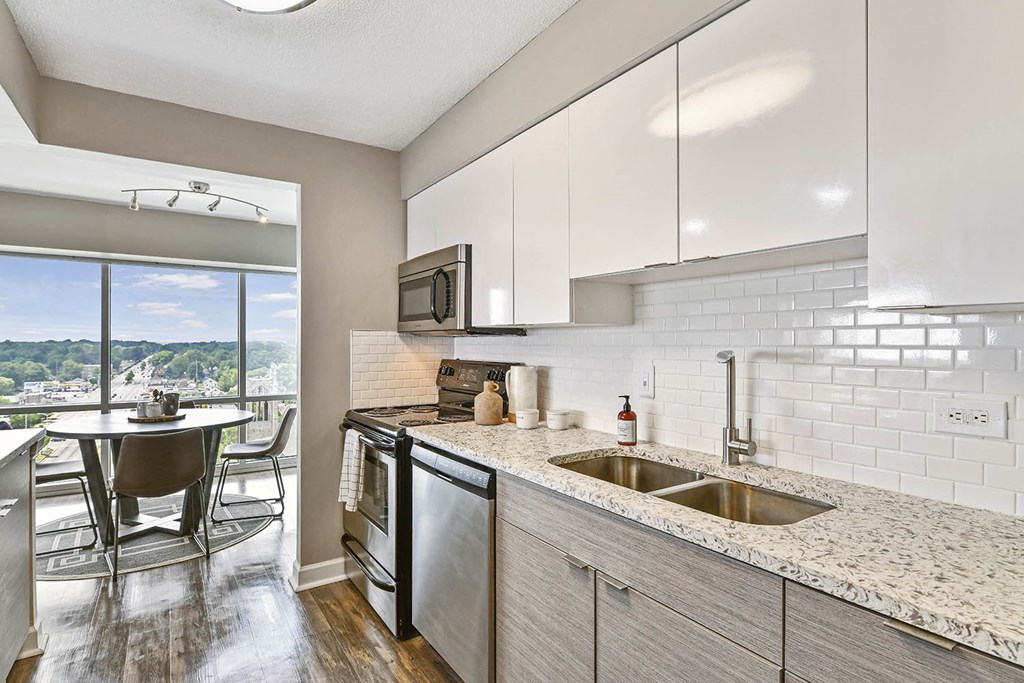 Newly updated kitchen with sleek white cabinets and granite countertops at CityView on Meridian, Indiana, 46208