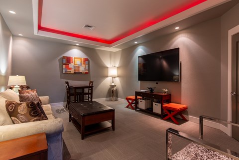 a living room with a couch and a tv at Corso Apartments, Missoula, MT