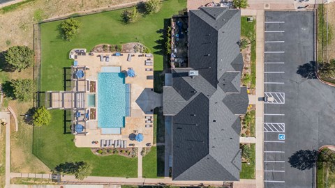 a birds eye view of a house with a swimming pool