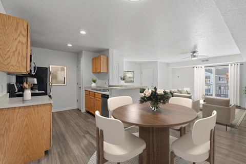 A modern kitchen with a dining table set for four.