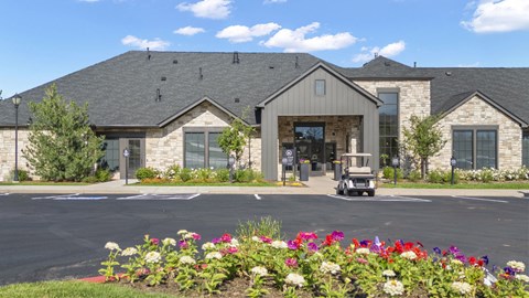 the front of a building with a golf cart in front of it