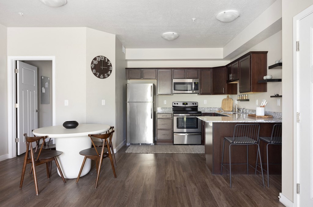 a kitchen and dining area in a 555 waverly unit