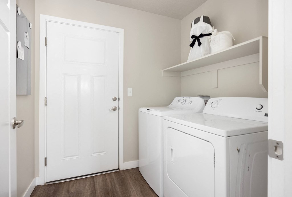 a laundry room with a washer and dryer