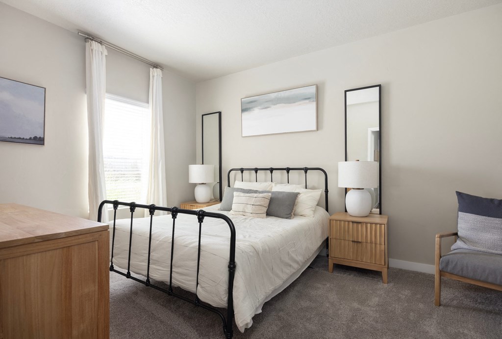 a bedroom with a bed in a room