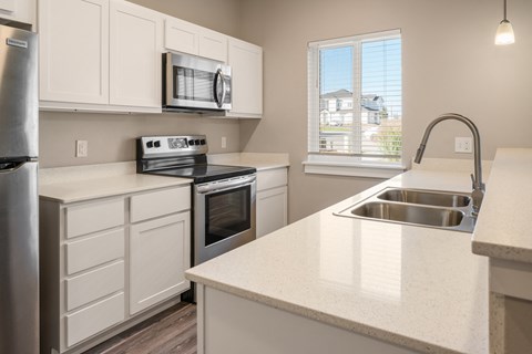 Kitchen with white cabinets at Southside Townhomes, Nampa