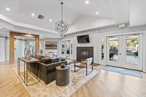 a living room with a couch and a fireplace