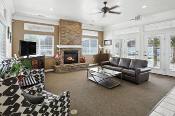 Clubroom With TV And Fireplace at Oakstone Apartments, Clearfield, 84015