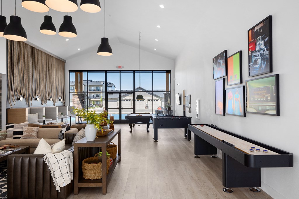 a game room with a foosball table and a pool table
