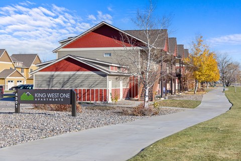 King West One Apartments sign in front of a building.