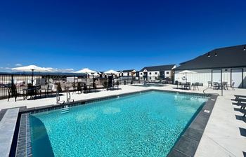 A large swimming pool with a mountain in the background at Silverbrook Apartments Apartments, Ridgeland, 59901
