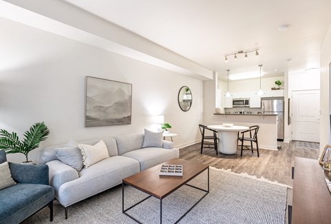a living room with a couch and a coffee table at Corso Apartments, Missoula, MT