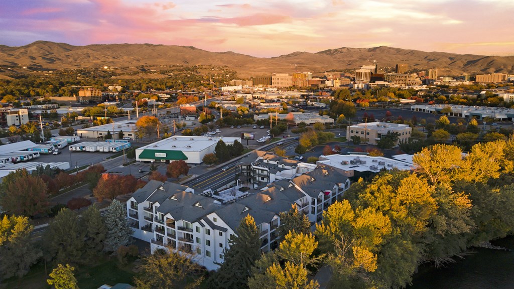 an aerial view of the city at sunset