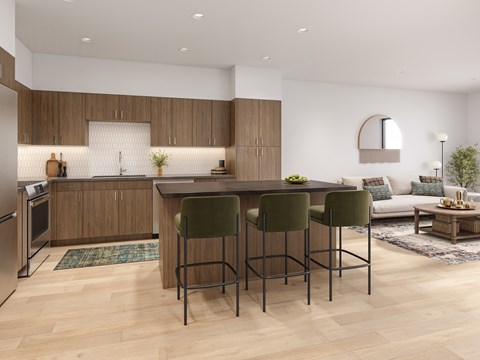 A modern kitchen with a bar stool in front of it.
