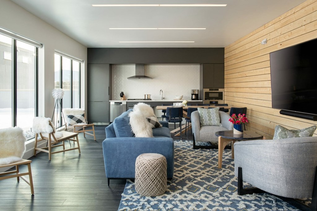 a living room filled with furniture and a flat screen tv