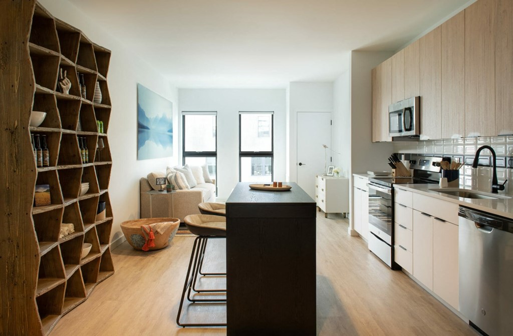 a kitchen and living room in a 555 waverly unit