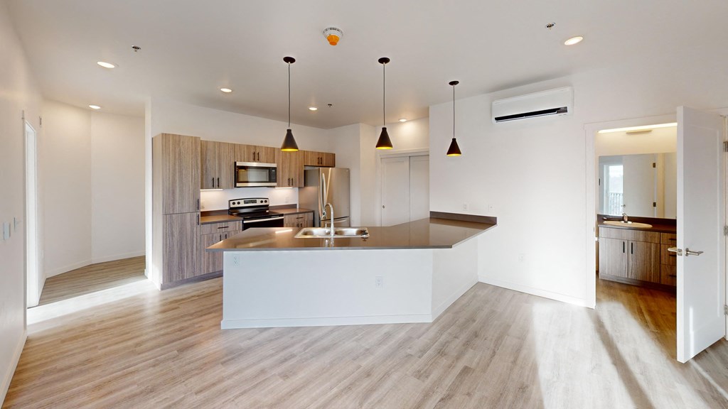 a kitchen with a sink and a counter top in a house