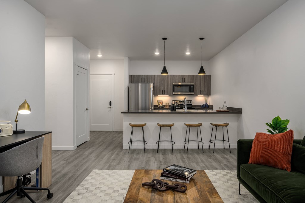 an open kitchen with a bar and a living room at Crosshatch, Idaho, 83714